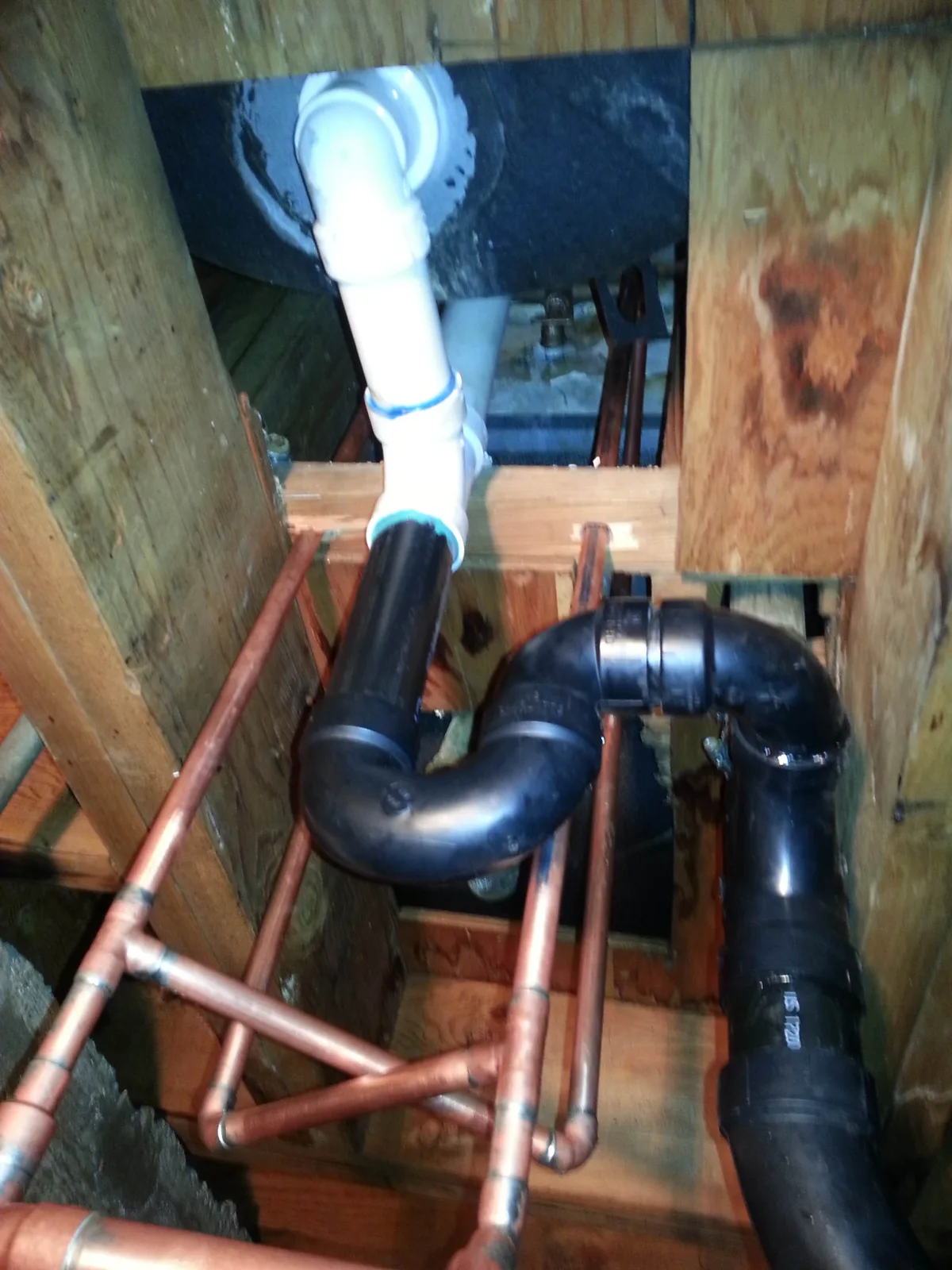 A copper and ABS repipe under a floor.